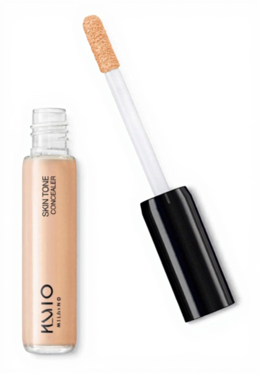 Application du correcteur KIKO Milano sur le visage